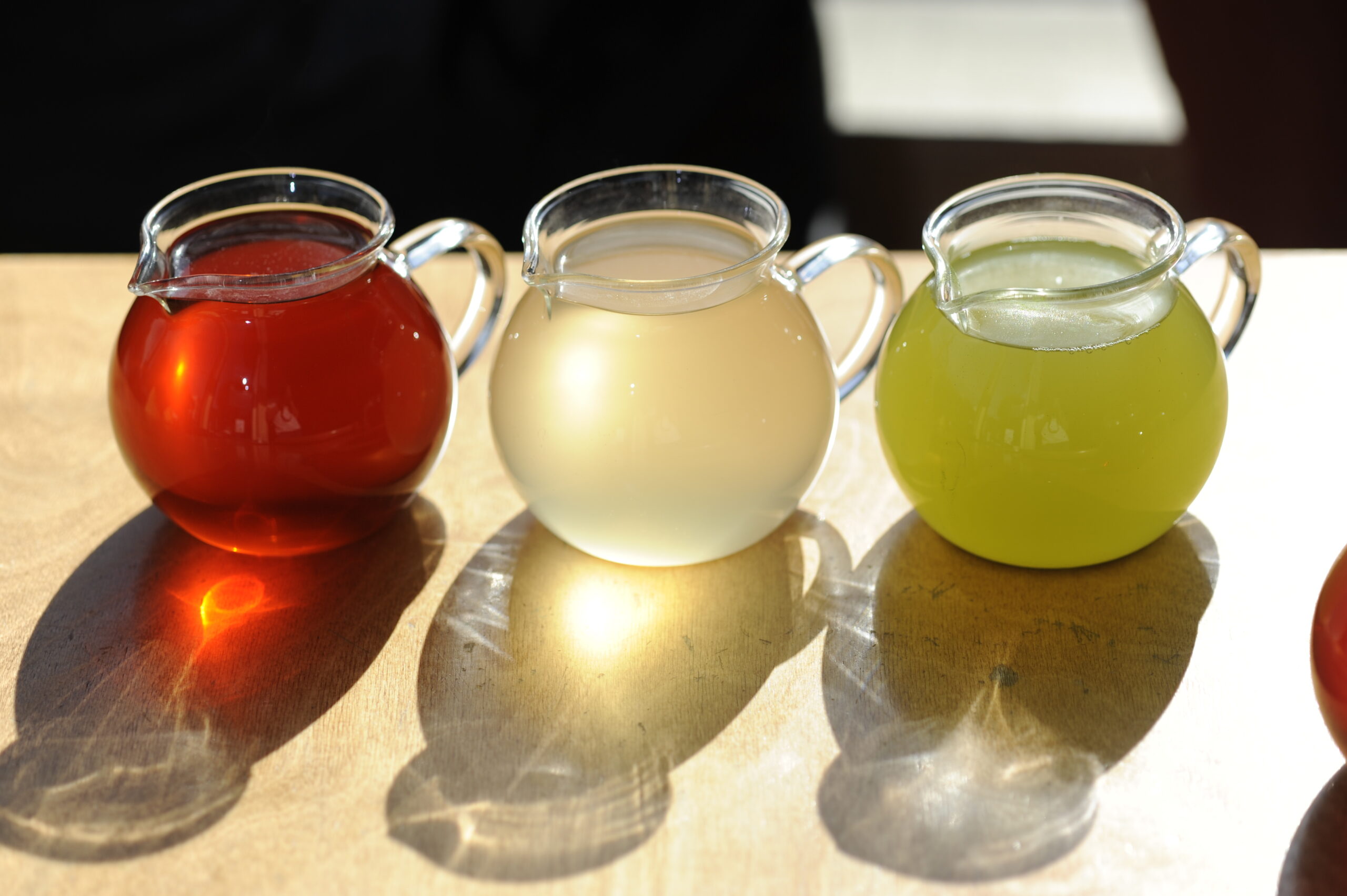 Three teapots with sustainably grown tea by Samovar Tea.