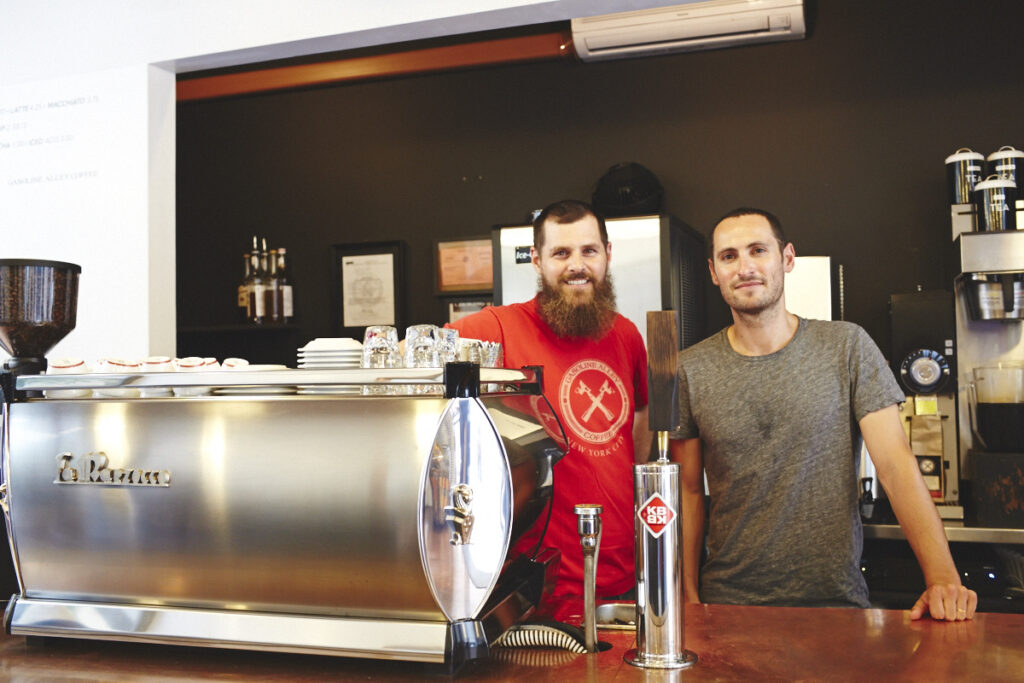 Portrait of co-owners of sustainable coffee shop, Gasoline Alley Coffee, Nick Carnevale and Neville Ross.