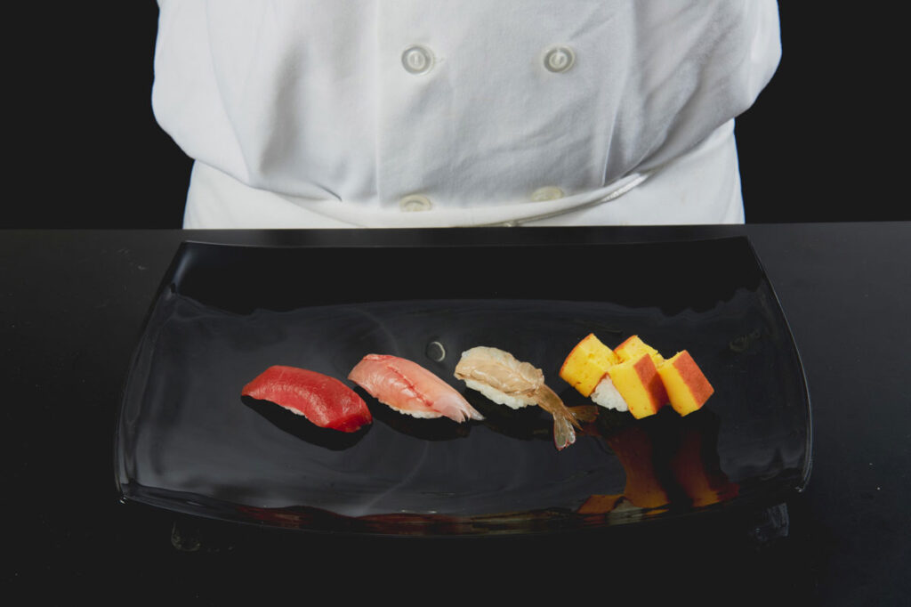Sushi from Sushi Nakazawa on a plate.