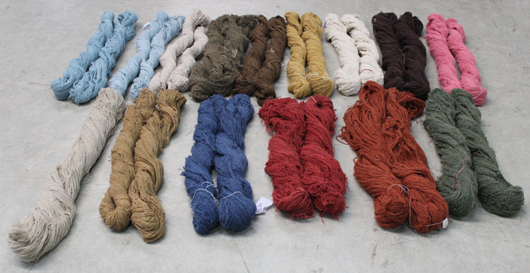 Dyed yarn used to create handmade area rugs for Emma Gardner Design.