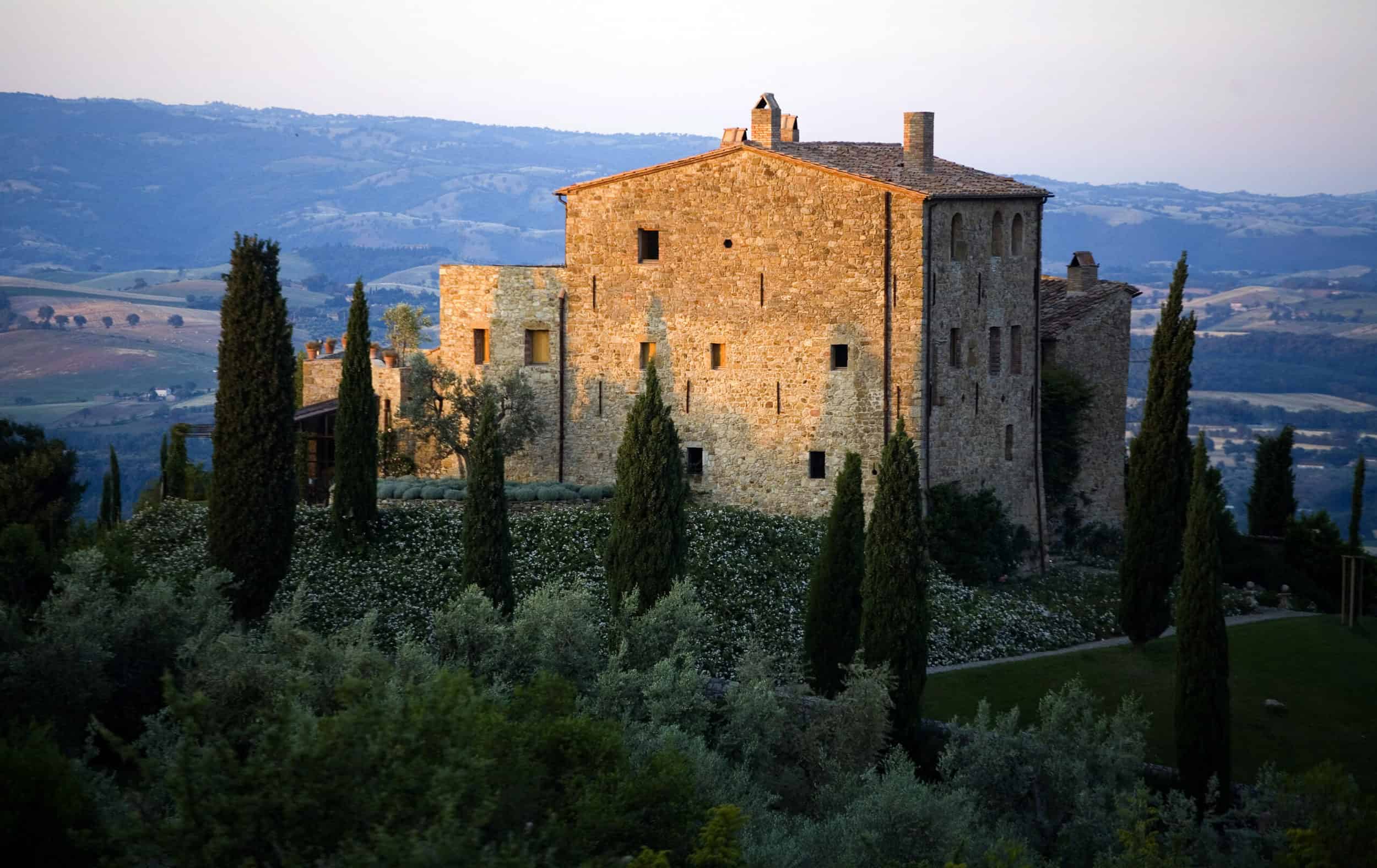 castello di vicarello, a boutique hotel in Tuscany, photographed at dawn.