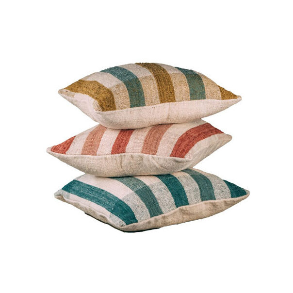 Three pillows with colored stripes stacked on top of each other.