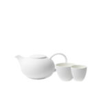 White tea set with a pot, small, and large cup.